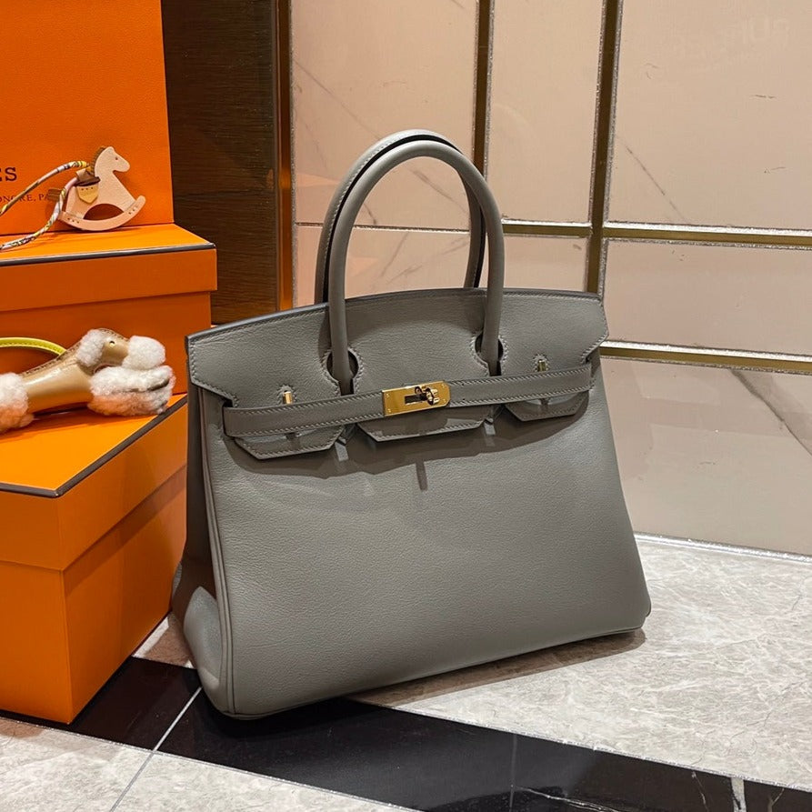 13342606739909331_803ea32b-4674-4b40-a4a1-8eda16827a29.jpg HN 30CM GREY SWIFT LEATHER GOLD HARDWARE - Image 1