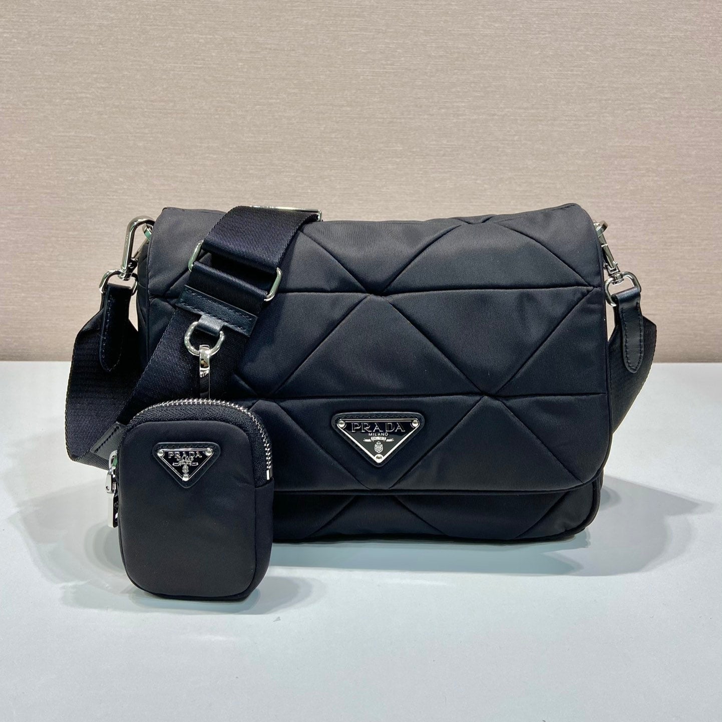 20230409_i1681024823_2345_0_jpg.jpg MEDIUM FLAP BAG 24 IN BLACK TRIANGULAR QUILTED PATTERN RE-NYLON - Image 1