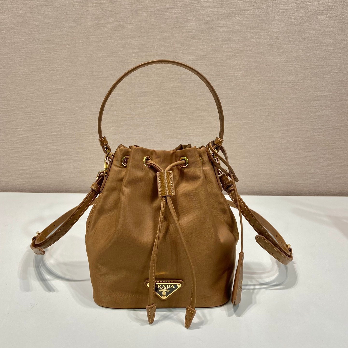 20240320_i1710913133_2063_0_jpg.jpg BUCKET BAG 19 IN RUSSET BROWN RE-NYLON AND CALFSKIN HANDLE - Image 1