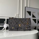 Chanel Maxi Flapbag in washed denim with gold-tone metal hardware