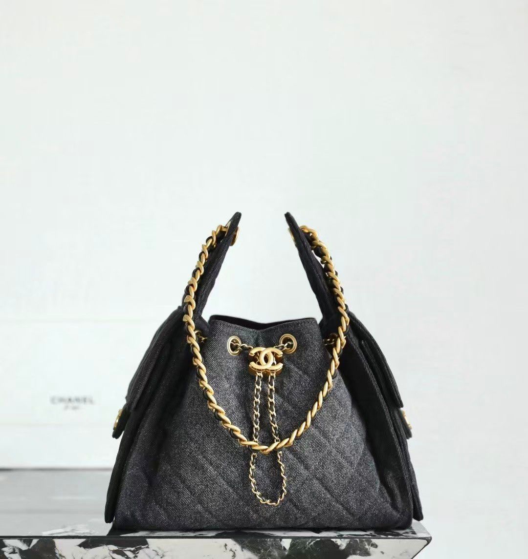 45895b8b-4339-4b1b-b217-8a57b986d5a1.jpeg Chanel 25cm Black Denim Bag with Gold Hardware - Image 1