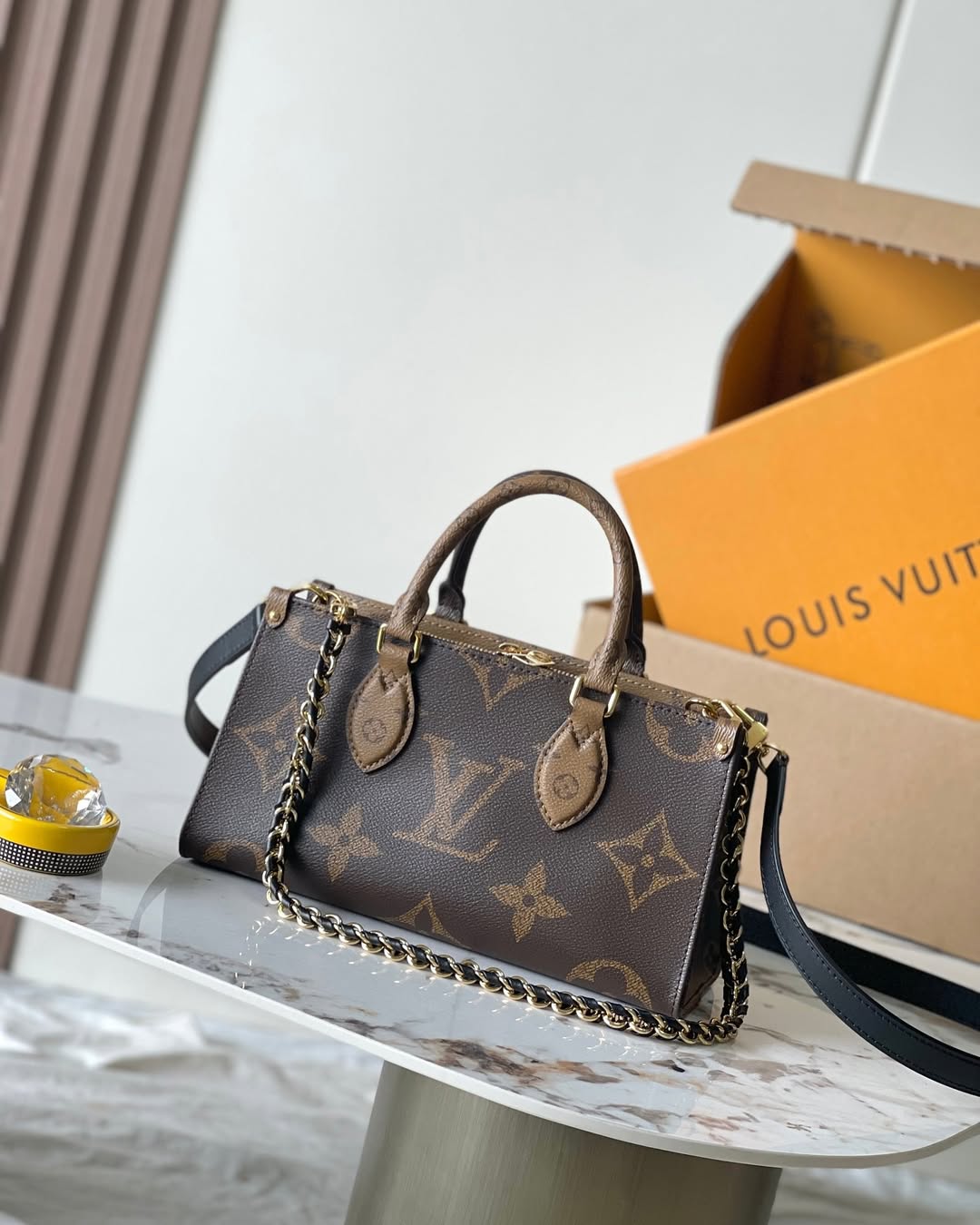 8880265-25×13×10.jpg LV OnTheGo East West Brown - Image 1