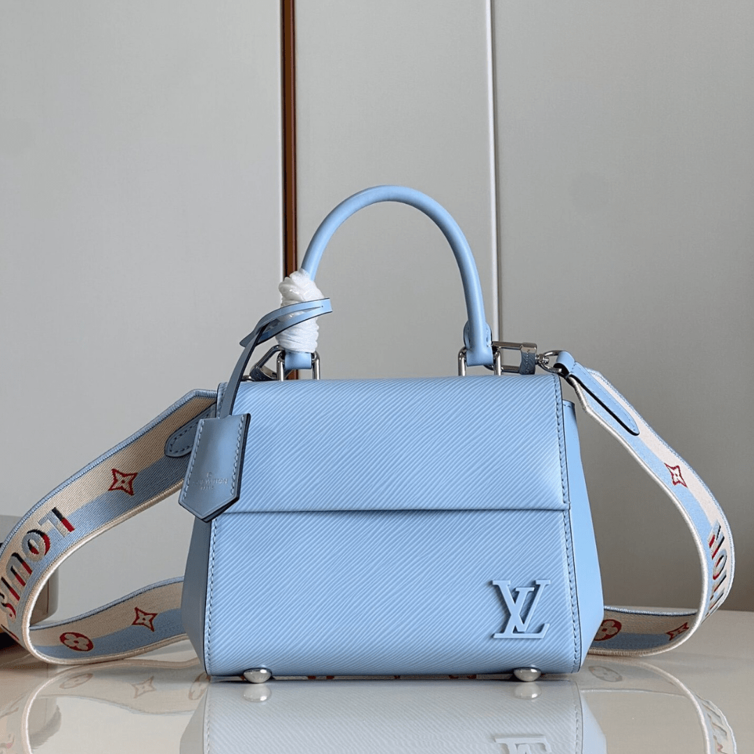 Untitled-design-2025-05-27T041512.120.png Louis Vuitton Clunny Blue Raised Pattern Handbags 20x16cm - Image 1