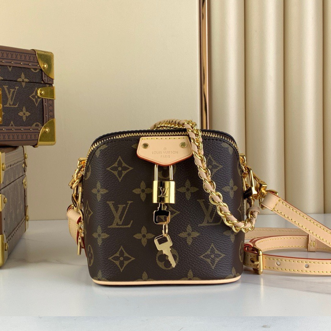 Untitled-design-2025-05-28T060229.757.png Louis Vuitton Lv Just In Case Monogram Pattern Handbags 14x13x11cm - Image 1