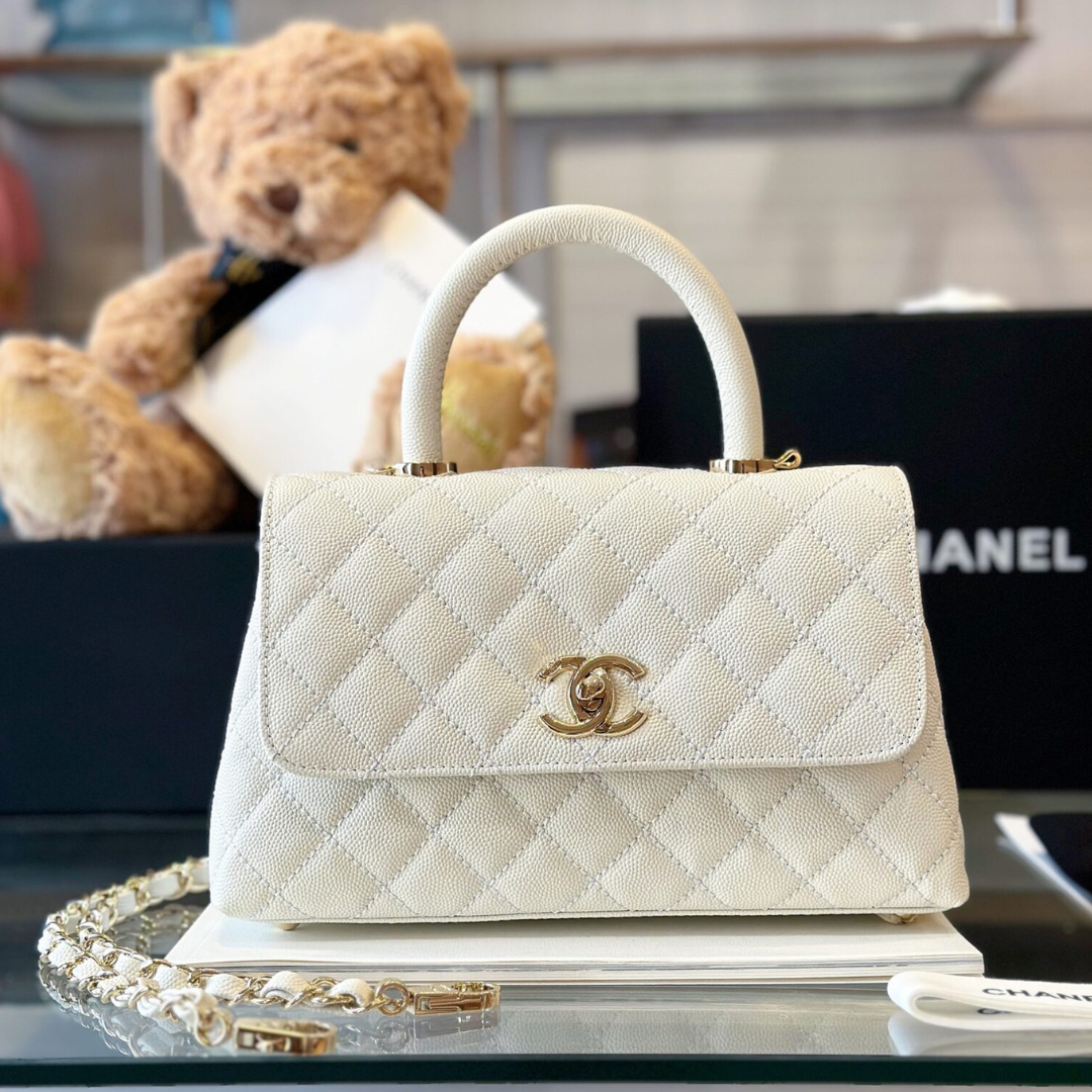 Untitled-design-2025-05-28T180437.328.png Chanel Coco Replica 11 Handbag Lizard Skin White With Lock Gold 23cm - Image 1