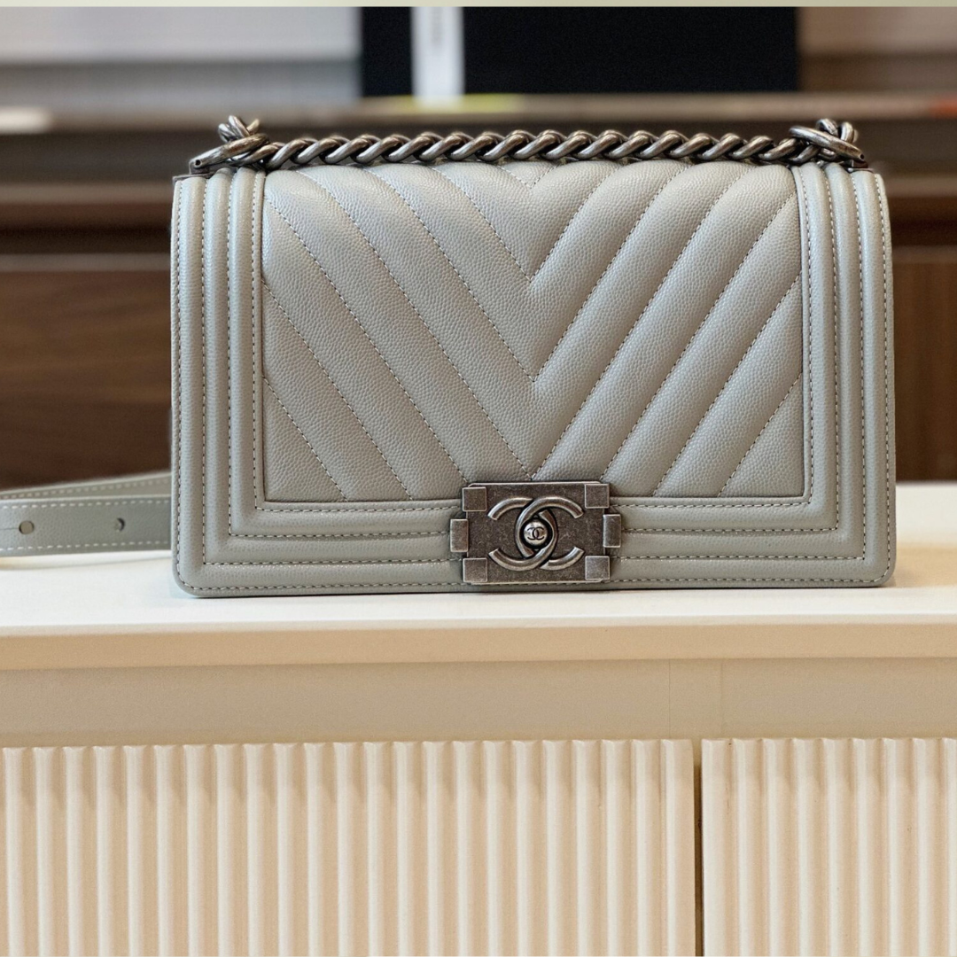 Untitled-design-2025-05-28T232239.121.png Chanel Boy Medium Handbags Grey Leather With Silver Lock 25cm - Image 1