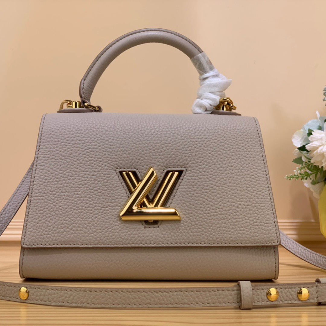 Untitled-design-2025-06-02T031114.570.png Louis Vuitton LV Twist Handle Like Auth Lock Gold Handbags 17x25x11cm - Image 1
