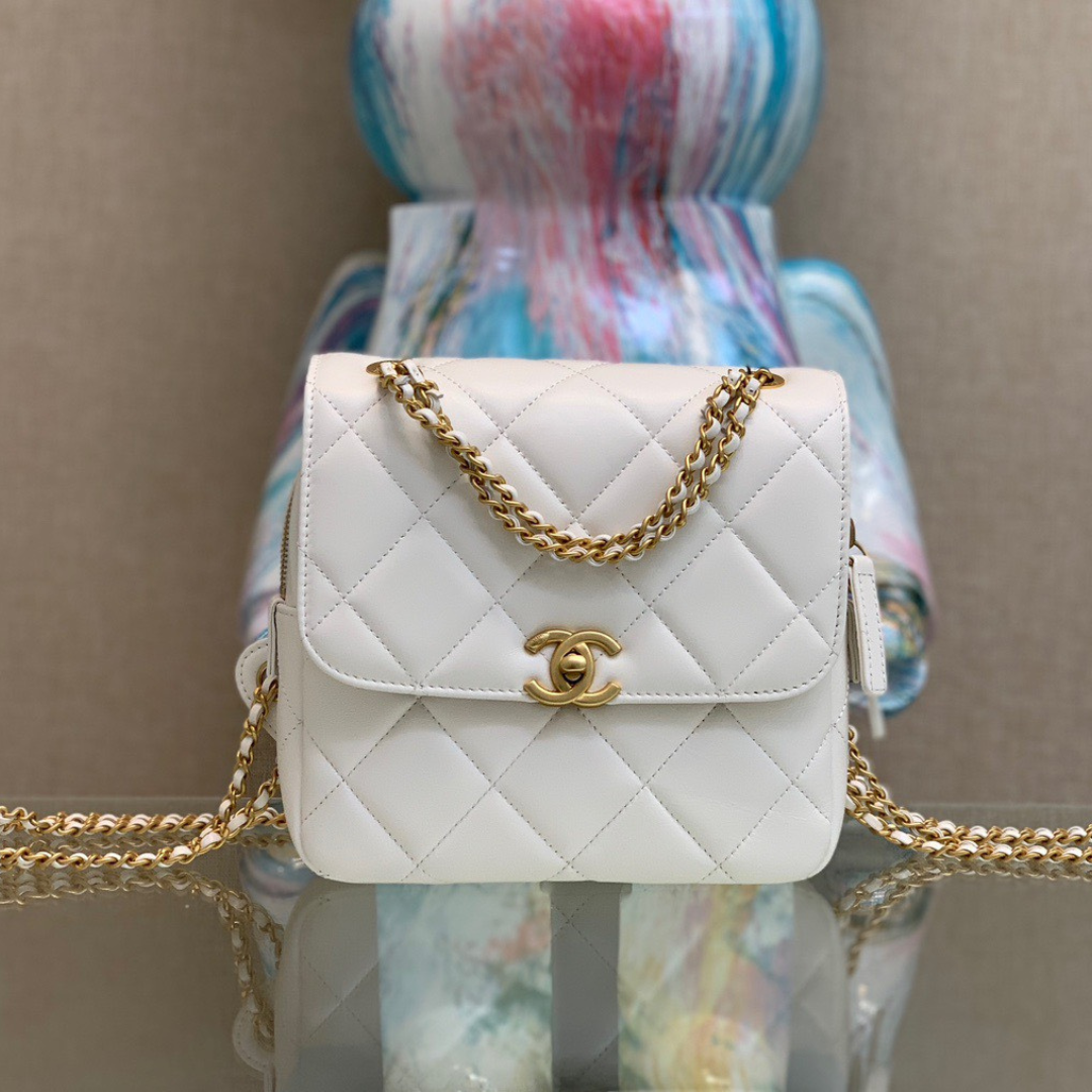 Untitled-design-2025-06-03T194450.689.png Chanel Mini Backpack Replica 11 Milk White With Gold Lock 18x20x11.5cm - Image 1