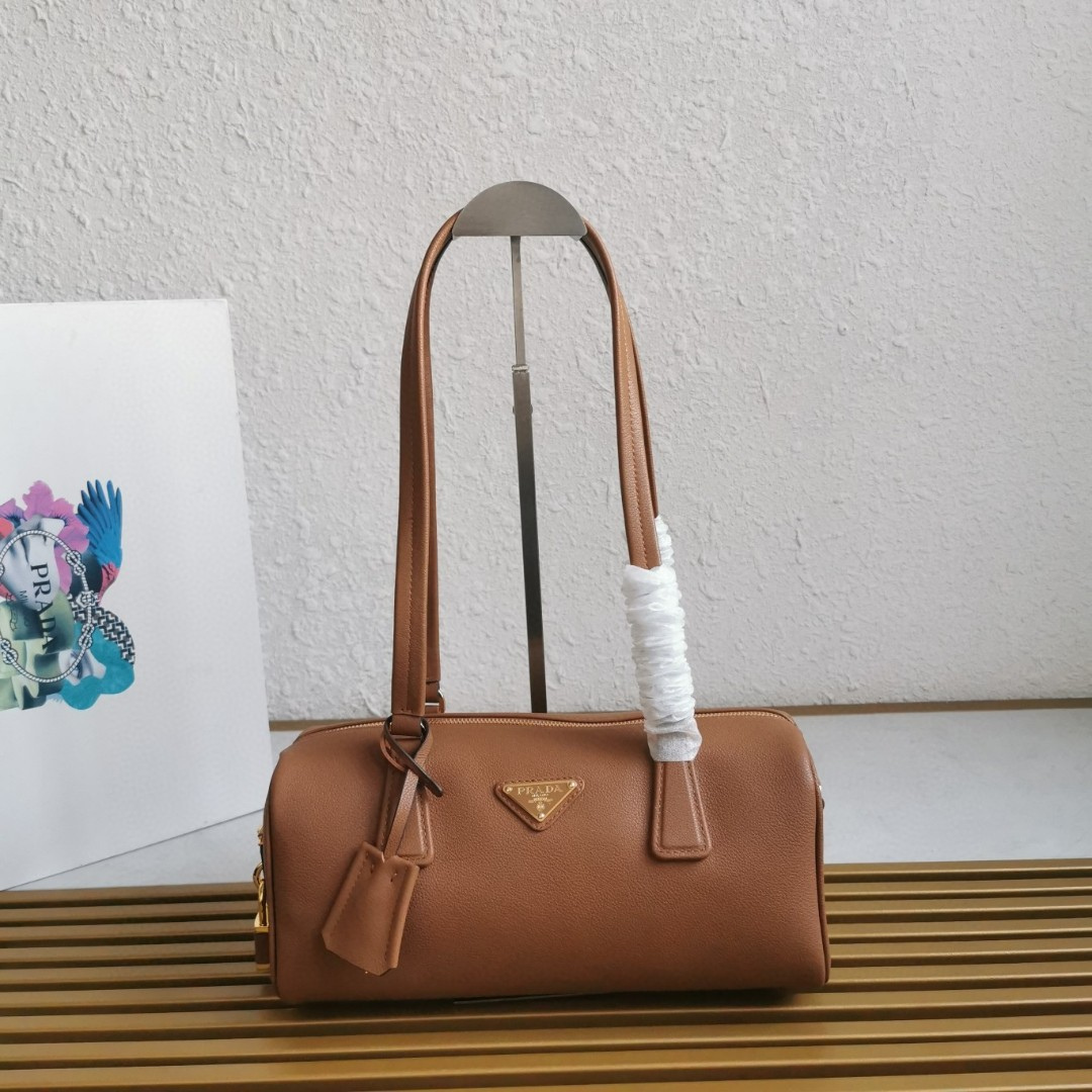 Untitled-design-2025-08-13T210332.149.png Prada Caramel Medium leather top-handle bag with padlock - Image 1