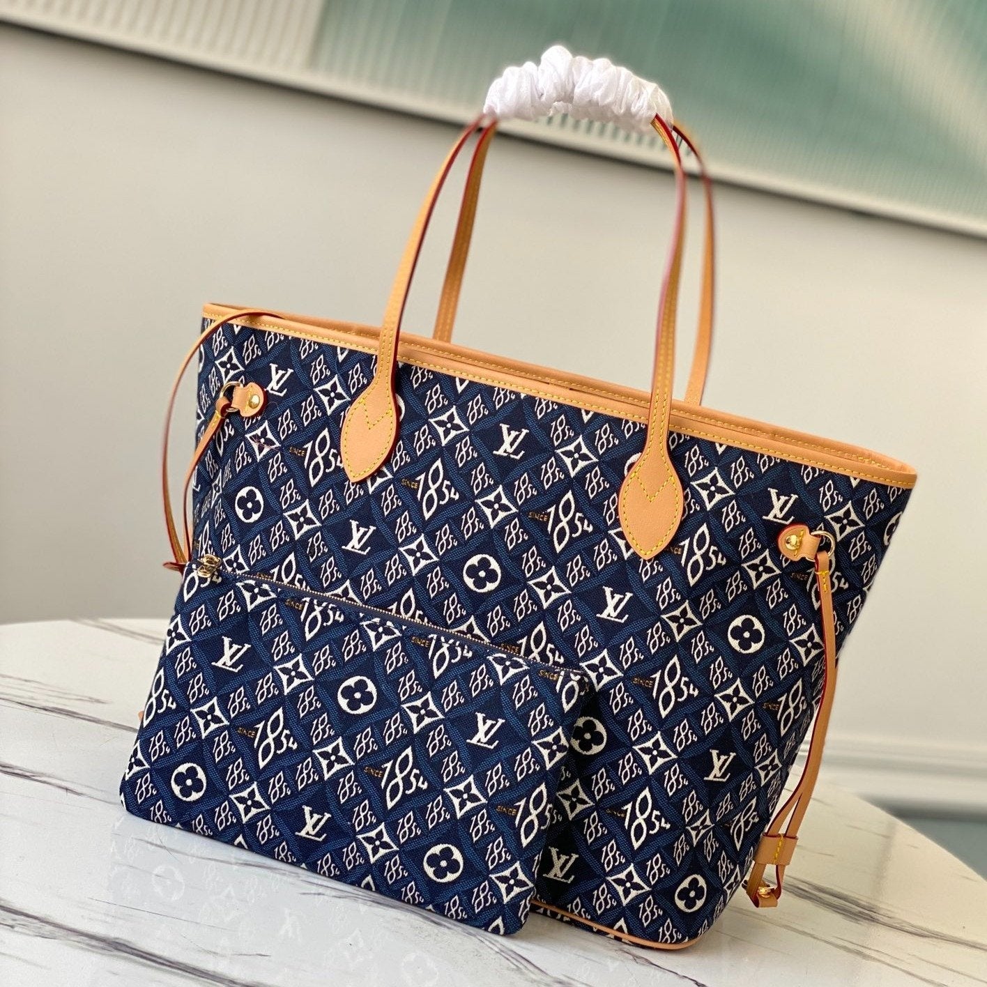 e2279f42-34b1-4ad7-9f01-cbcbf9cf860c_3d2e2a32-5247-48de-aa7e-acde2b41730c.jpg LV NEVERFULL MM WITH DUSTBAG 1854 MONOGRAM JACQUARD - Image 1