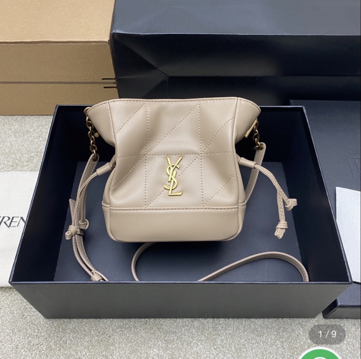 Screenshot Saint Laurent Jamie mini shoulder pouch in beige lambskin leather. - Image 1