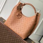Louis Vuitton Carmel Mahina Leather Hobo Bag in Cognac